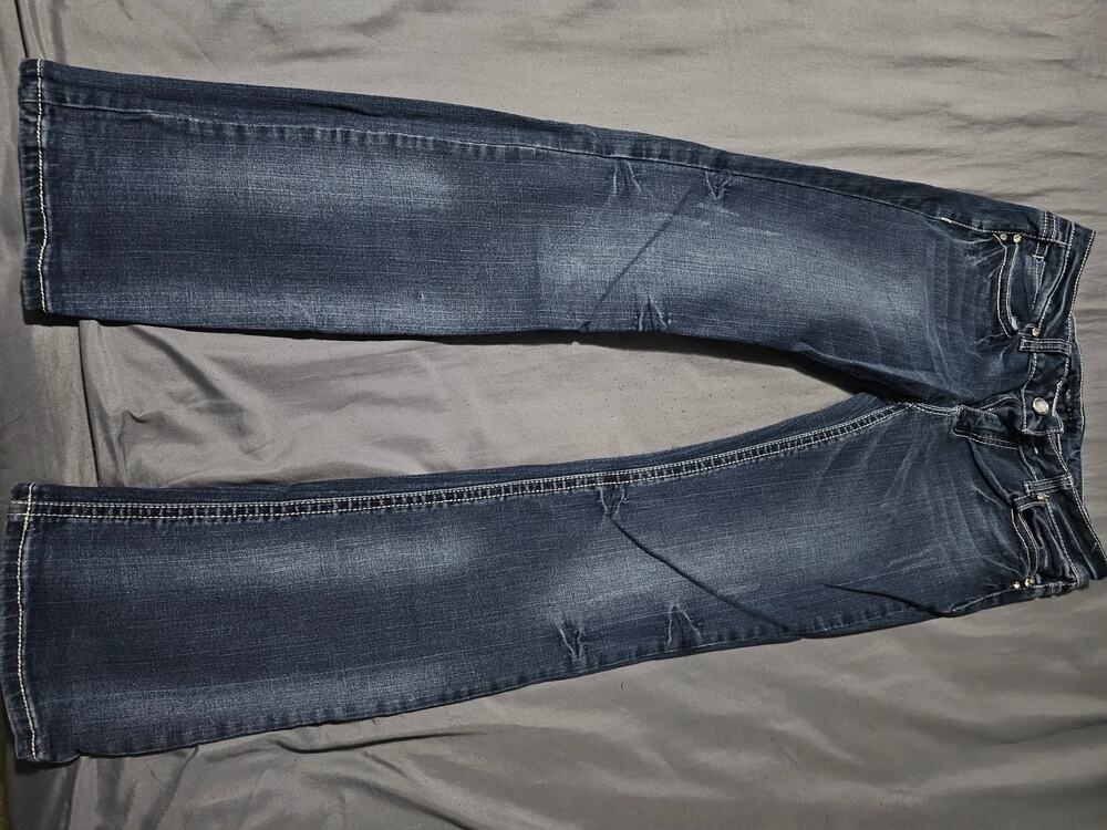 Dark wash denim jeans contrast stitching faded whiskering embellished back pocke